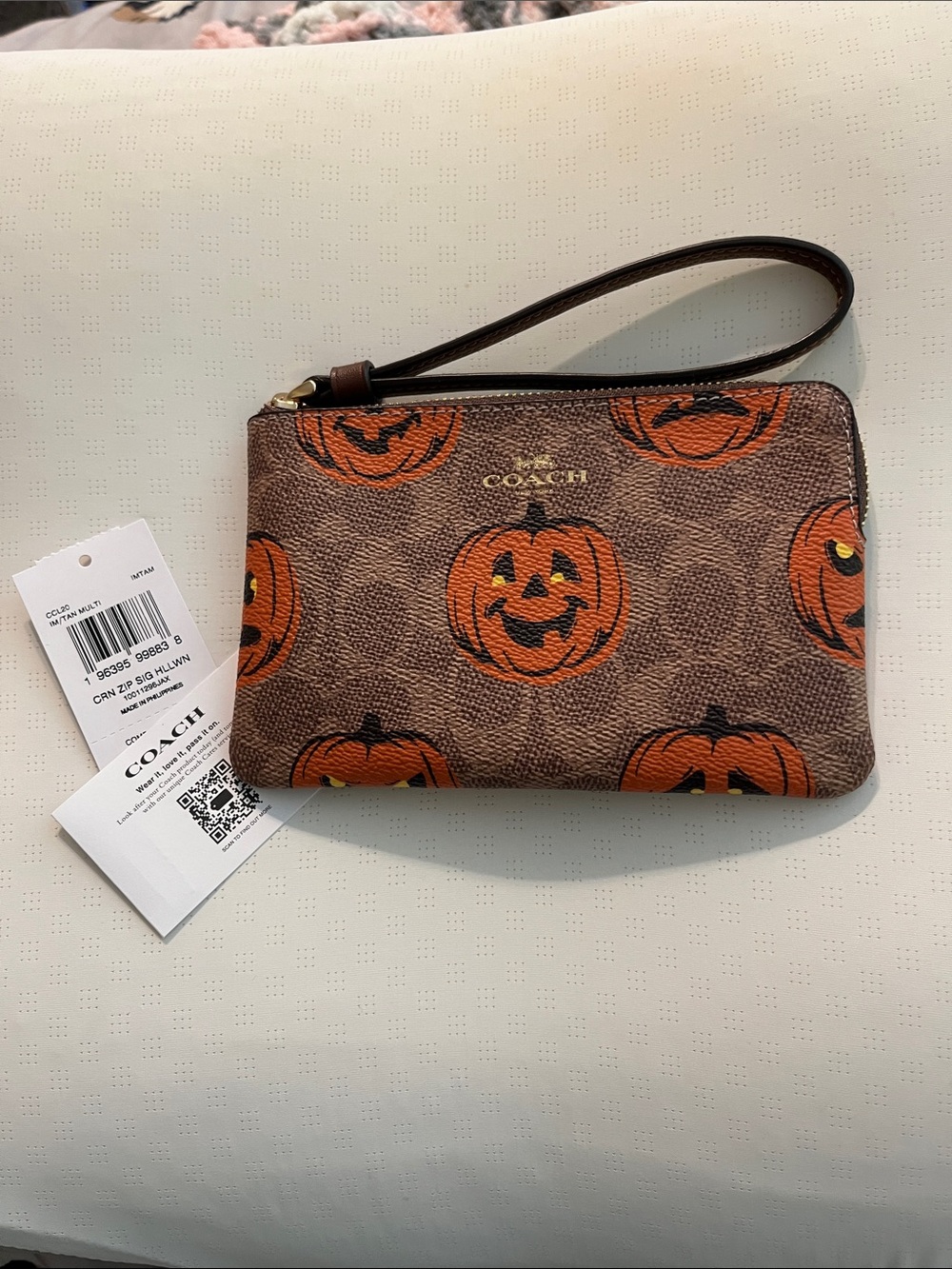 NWT Coach Brown Wristlet with Orange Jack-O'-Lantern Print Corner Zip